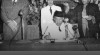 Pengambilan sumpah jabatan pelantikan wali negara Pasundan, RAA Wiranatakusumah (memakai kacamata dan dekat mikrofon) di Bandung. Tampak H.J. van Mook menyaksikan prosesi pengambilan sumpah, 26 April 1948.