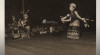 Foto beberapa penari memakai pakaian adat sedang membawakan Tarian Dayak dan diiringi musik tradisional pada malam kesenian di Samarinda, 19 Juli 1957.