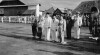 Foto Presiden Sukarno, Wakil Presiden Moh. Hatta, dan Duta Besar Filipina Dr. Proceso Sebastian mendengarkan lagu kebangsaan Indonesia dan Filipina di lapangan terbang Kemayoran saat menyambut Presiden Filipina Elpidio Quirino, 16 Juli 1952.